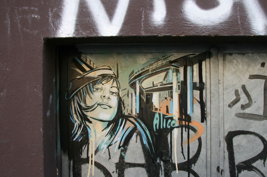 Girl with a coquettish smile: Street Art by AliCé (Alice Pasquini) in Berlin