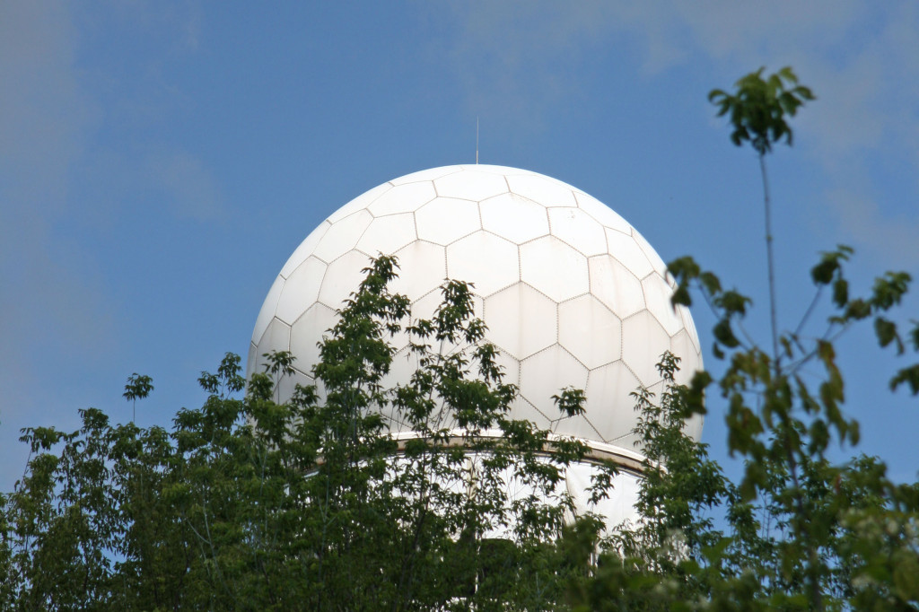 My first glimpse of the NSA Listening Station at Teufelsberg above the trees of the Grunewald Forest