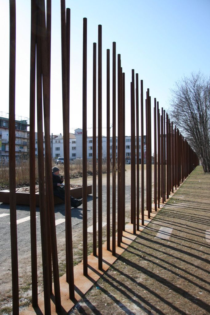 Poles mark the line of the Berlin Wall at Gedenkstätte Berliner Mauer Memorial Grounds on Bernauer Strasse