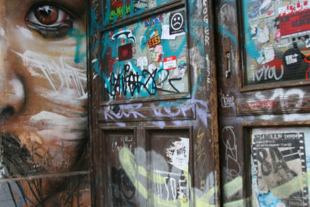 All those in favour say 'Eye': Street Art by Matt Adnate in a Berlin doorway