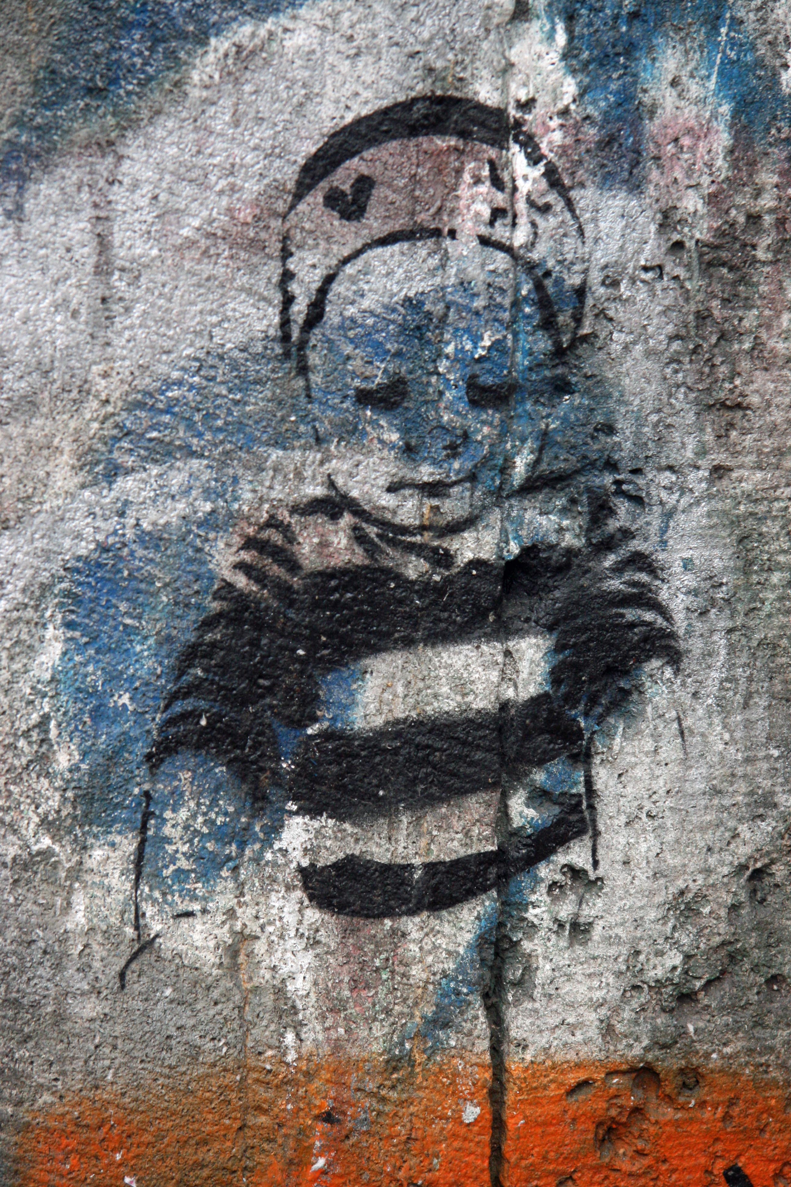 Boy in Stripes: Street Art by Unknown Artist in Berlin
