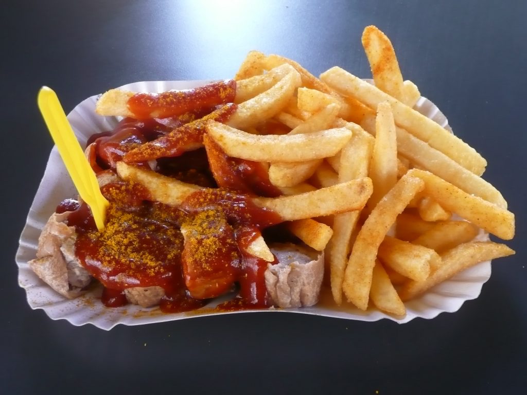 Currywurst and Chips (Currywurst mit Pommes) at Konnopke's Imbiss in Berlin