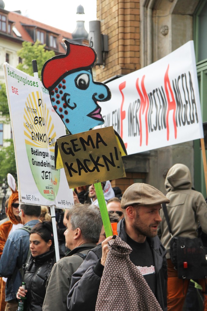 A protester with a placard at the GEMA protest at the Kulturbrauerei in Berlin