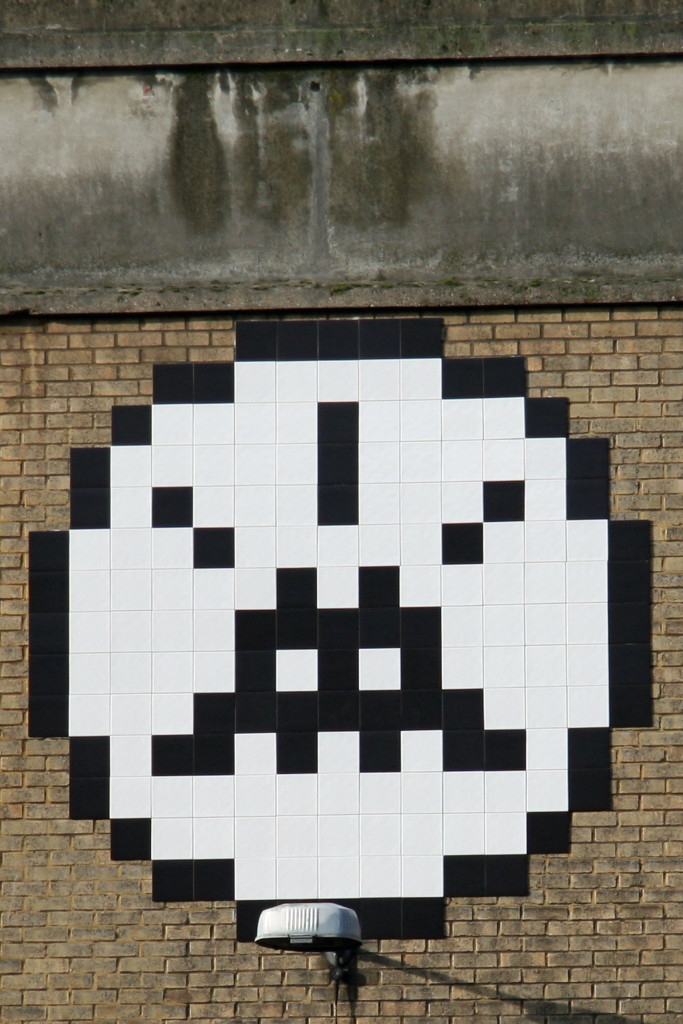 Invader 12: Tile Mosaic Space Invader Street Art overlooks the Truman Brewery complex in London