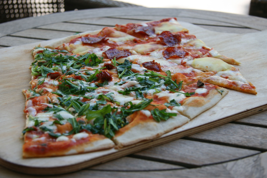Slices of Spicy Salami and Ruccola (Rocket) pizza at Caramello in Prenzlauer Berg, Berlin