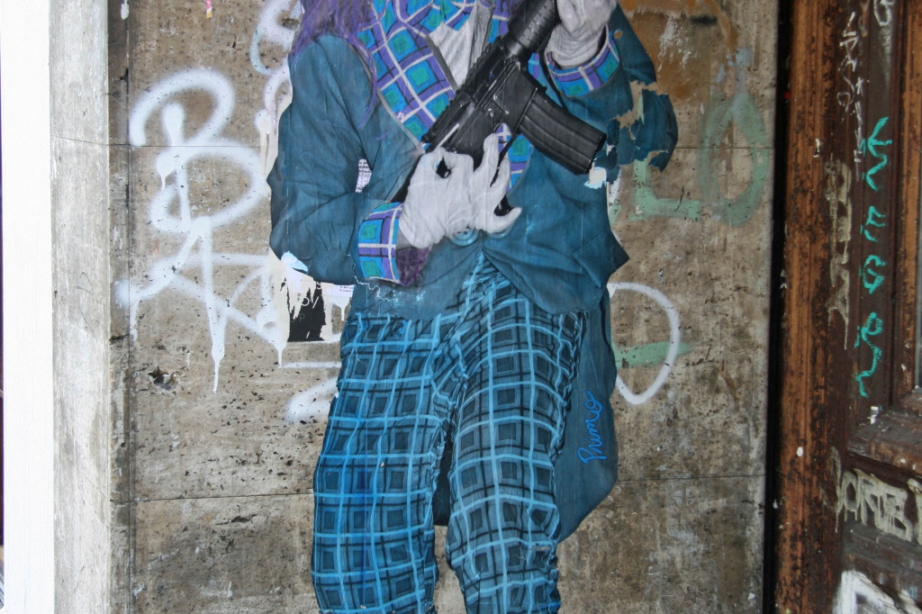 Clown With a Rifle Guitar: Street Art by Primo in Berlin