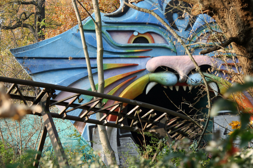 The track of the Spreeblitz ride enters a psychedelic tiger's mouth at Spreepark Plänterwald, an abandoned Theme Park in Berlin