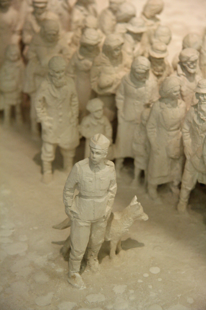 A guard with a dog and prisoners in a model of Auschwitz by Polish sculptor Mieczyslaw Stobierski at the Deutsches Historisches Museum (German Historical Museum) in Berlin
