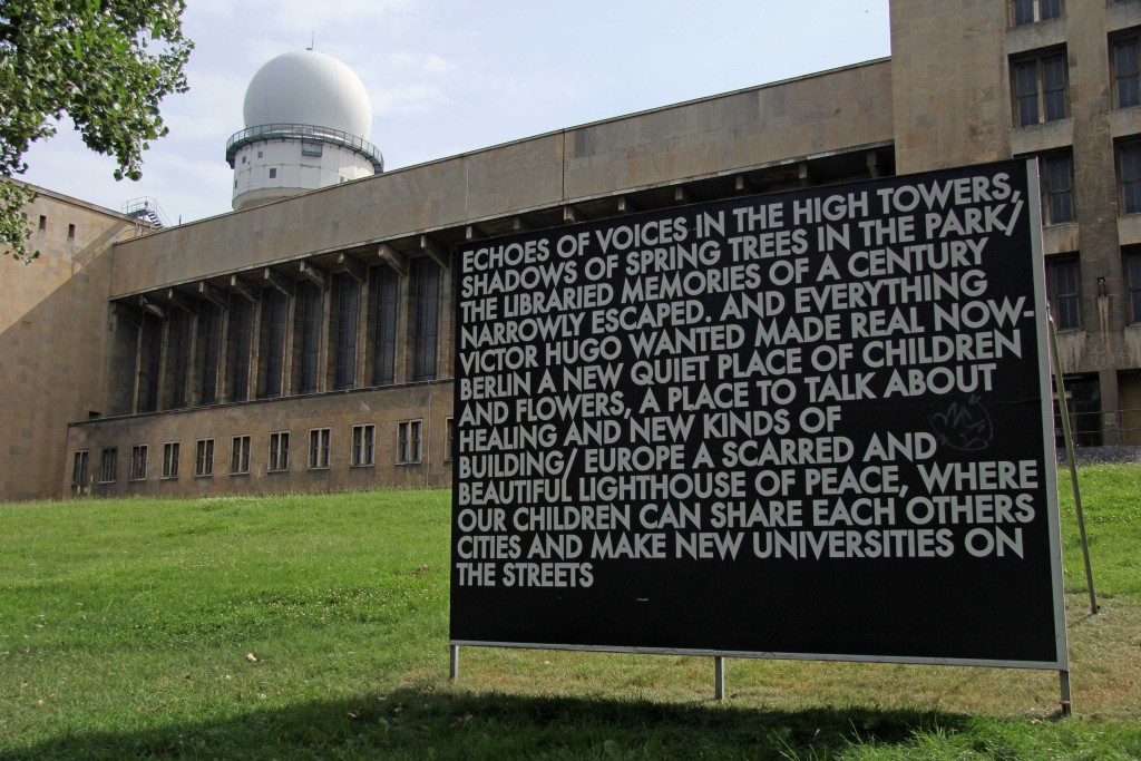 Echoes of voices in the high towers – a billboard installation by Robert Montgomery at the former Tempelhof Airport in Berlin