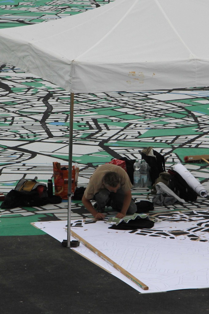An artist at work on the map on the Schlossplatz, the City of Diversity Exhibit part of Berlin's 775th Anniversary celebrations