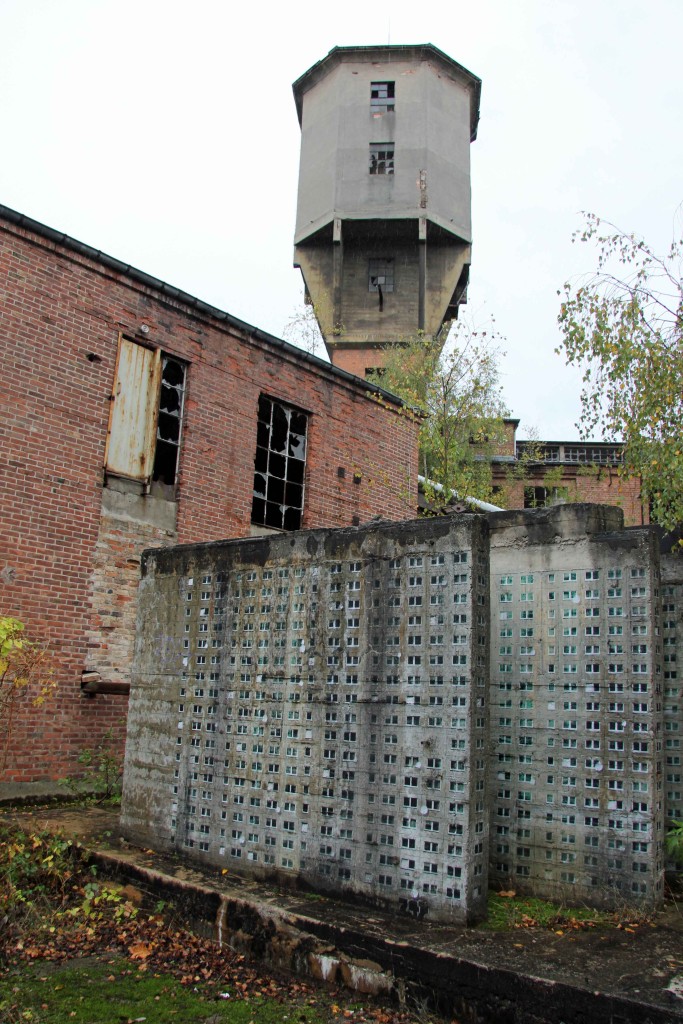 The outside of Papierfabrik Wolfswinkel, an abandoned paper mill near Berlin and artwork by EVOL