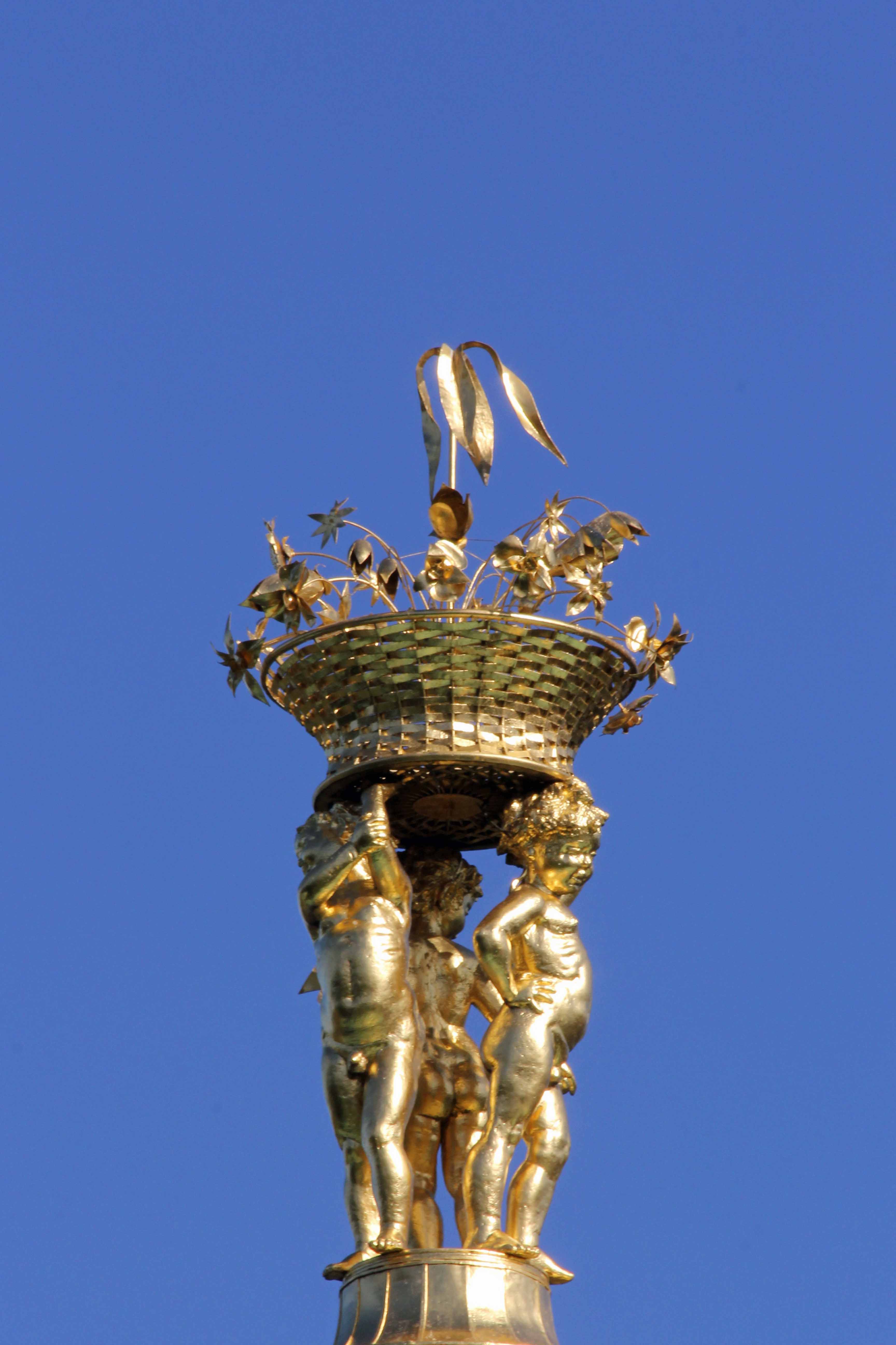 A gold statue atop The Belvedere in the Palace Gardens of Schloss Charlottenburg in Berlin