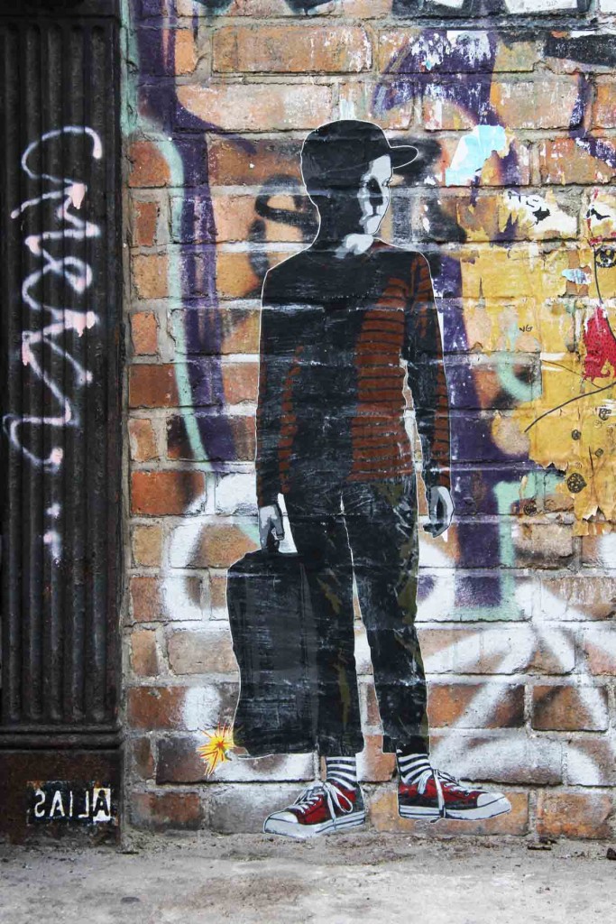 Boy With Suitcase Bomb - Street Art by ALIAS in Berlin
