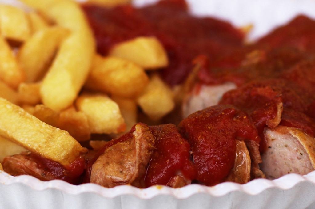 Close up of Currywurst at Schmidts Imbiss Berlin - one of the best Currywurst in Berlin
