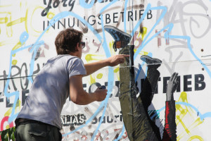 ALIAS Pasting a New Ikarus Street Art Piece in Berlin
