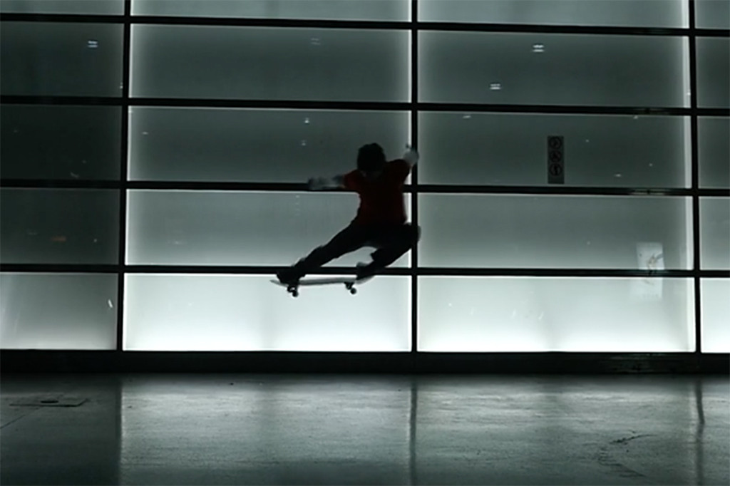 Michael Mackrodt doing an ollie silhouetted against the lit wall of the underground S-Bahnhof Potsdamer Platz in Berlin. Still from One Night in Berlin - Michael Mackrodt by Robin Pailler for Desillusion Magazine
