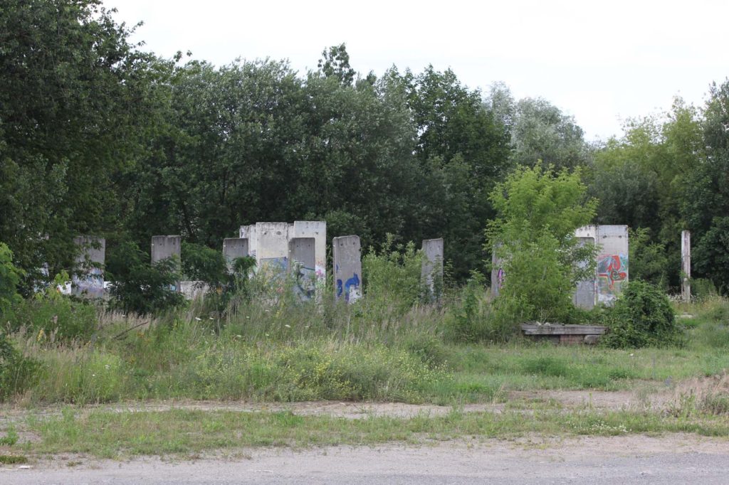Berlin Wall Graveyard - Sections of the Berlin wall on waste ground in Teltow that will soon be part of the Teltow Marina - Photo June 2016
