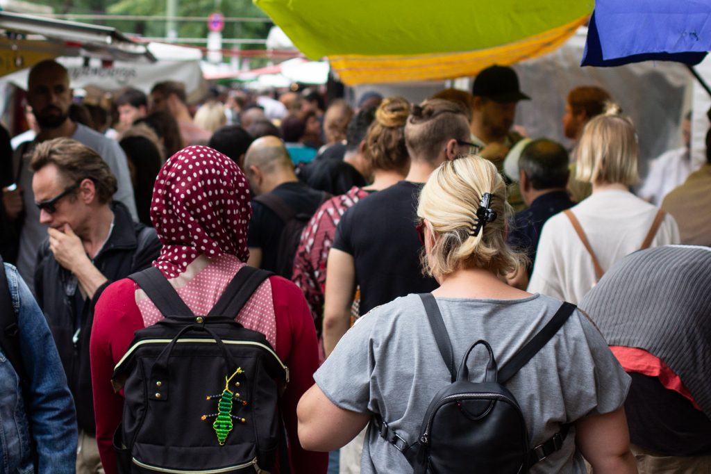 Crowds walking through the very colourful Turkish Market on Maybachufer in Berlin Neukölln